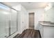 Well-lit bathroom featuring a glass-enclosed shower and granite countertops at 294 Torslanda Ln, Summerville, SC 29486
