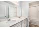 Bright bathroom featuring double sinks, spacious vanity, and tiled floors at 294 Torslanda Ln, Summerville, SC 29486