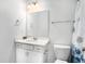 Well-lit bathroom featuring a vanity with a bright mirror, toilet, and bathtub with a decorative shower curtain at 294 Torslanda Ln, Summerville, SC 29486