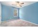 Comfortable bedroom with a ceiling fan and serene blue walls at 294 Torslanda Ln, Summerville, SC 29486