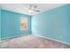 Comfortable bedroom with a ceiling fan, light fixture, and bright blue walls at 294 Torslanda Ln, Summerville, SC 29486