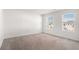 Neutral bedroom with lots of natural light from the two windows at 294 Torslanda Ln, Summerville, SC 29486