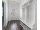 Bright entryway featuring white walls, wood floors, storage nook with hooks, and frosted glass front door at 294 Torslanda Ln, Summerville, SC 29486