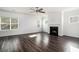 Open living room with hardwood floors, fireplace, bright windows, and recessed lighting at 294 Torslanda Ln, Summerville, SC 29486