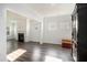 Bright living room featuring a fireplace, neutral walls, and hardwood flooring at 294 Torslanda Ln, Summerville, SC 29486