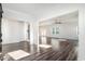 Open-concept living space with hardwood flooring and abundant natural light at 294 Torslanda Ln, Summerville, SC 29486
