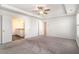 Spacious main bedroom with a ceiling fan and an ensuite bathroom at 294 Torslanda Ln, Summerville, SC 29486