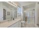 Bright bathroom featuring vanity, mirror, and glass-enclosed shower with tile surround at 2978 Sweetleaf Ln, Johns Island, SC 29455