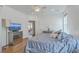 Well-lit main bedroom with ceiling fan, side tables, and doorway to balcony at 2978 Sweetleaf Ln, Johns Island, SC 29455