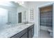 Modern bathroom with granite counters, a sink, and framed art, offering a clean and stylish space at 312 Coki Amalie Ct, Charleston, SC 29492