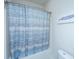 Bathtub featuring a blue striped shower curtain and a whale art print, offering a clean and stylish space at 312 Coki Amalie Ct, Charleston, SC 29492
