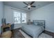 Bedroom with desk, featuring a comfy bed, wood floors, and natural light from the window at 312 Coki Amalie Ct, Charleston, SC 29492