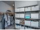 Well-organized closet with shelves, hanging rods, and storage bins for efficient clothing and accessory management at 312 Coki Amalie Ct, Charleston, SC 29492