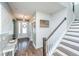 Bright foyer featuring wood floors, stairs, and an inviting entrance with a wreath at 312 Coki Amalie Ct, Charleston, SC 29492