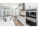 Bright kitchen featuring granite counters, stainless steel appliances, and an island with a sink at 312 Coki Amalie Ct, Charleston, SC 29492