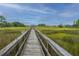 Picturesque marsh walk leading to waterfront, offering stunning natural beauty and tranquil escape at 312 Coki Amalie Ct, Charleston, SC 29492