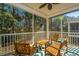 Inviting screened-in patio with comfortable seating and a tranquil view of the surrounding lush greenery at 312 Coki Amalie Ct, Charleston, SC 29492