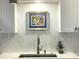 Kitchen sink area featuring stylish tiling, modern faucet, and clean, bright design at 330 Concord St # 11D, Charleston, SC 29401