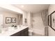 Bright bathroom featuring double vanity, tub-shower combo, and decorative art at 332 Calm Water Way, Summerville, SC 29486