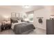 Cozy bedroom with neutral color scheme, carpeted floor, and decorative artwork at 332 Calm Water Way, Summerville, SC 29486