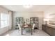 Bright home office with a large window, modern shelving, and a comfortable workspace, creating a productive and inviting atmosphere at 332 Calm Water Way, Summerville, SC 29486