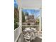 Charming covered porch features a table and chairs for outdoor dining and entertaining with garden views at 34 Anson St, Charleston, SC 29401