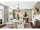 Elegant dining room featuring a chandelier, and ample seating, perfect for hosting gatherings at 34 Anson St, Charleston, SC 29401