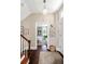 Foyer with stairs, hardwood floors, an entry door and views to dining room at 34 Anson St, Charleston, SC 29401