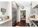 Bright kitchen features a stainless steel refrigerator, white subway tile, and hardwood floors at 34 Anson St, Charleston, SC 29401