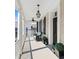 Relaxing covered porch with ceiling fan, lighting and comfortable seating at 34 Anson St, Charleston, SC 29401