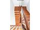 View of a wooden staircase with white railings, showcasing its craftsmanship and design from above at 34 Anson St, Charleston, SC 29401