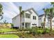 Charming two-story home with white siding, a cozy front porch, and well-manicured landscaping at 356 Claret Cup Way, Charleston, SC 29414