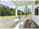 Covered patio seating with wooded views at 356 Claret Cup Way, Charleston, SC 29414