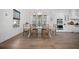 Dining room with table, chairs, and view into modern white kitchen at 3785 Summerton St, Mount Pleasant, SC 29466