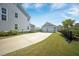 Spacious driveway leading to a detached two-car garage adjacent to a well-maintained home at 3785 Summerton St, Mount Pleasant, SC 29466