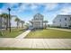 Charming two-story home boasting a welcoming front porch, well-manicured lawn, and inviting sidewalk entrance at 3785 Summerton St, Mount Pleasant, SC 29466