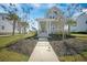 Inviting two-story home featuring a spacious front porch, manicured lawn, and sidewalk leading to the entrance at 3785 Summerton St, Mount Pleasant, SC 29466