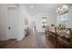 Hallway with wood floors, wainscoting, and a view into the dining area at 3785 Summerton St, Mount Pleasant, SC 29466