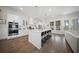 Spacious kitchen with white cabinets, stainless steel appliances, and a large center island with seating at 3785 Summerton St, Mount Pleasant, SC 29466