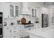 Bright kitchen with white cabinets, backsplash, stainless steel appliances, and cooktop at 3785 Summerton St, Mount Pleasant, SC 29466