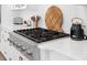 Close up of a stainless gas cooktop and white countertops and cabinets at 3785 Summerton St, Mount Pleasant, SC 29466