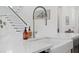Close up of a stainless steel sink and faucet on a white kitchen island at 3785 Summerton St, Mount Pleasant, SC 29466