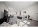 Spacious living area with neutral decor, plush seating, and access to the staircase at 3785 Summerton St, Mount Pleasant, SC 29466