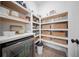 Walk-in pantry with white shelving, wicker baskets, and a beverage refrigerator at 3785 Summerton St, Mount Pleasant, SC 29466