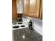 Close up of a kitchen stove with granite countertops and white subway tile backsplash at 391 Furman Ln, Ladson, SC 29456