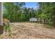 View of backyard featuring a home and lush green trees at 413 Peacock Ln, Summerville, SC 29486