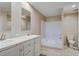 Bathroom featuring double sinks, vanity, and a shower-tub combination with neutral walls at 413 Peacock Ln, Summerville, SC 29486