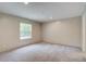 Bright bedroom features neutral carpet, natural light from the window, and light walls at 413 Peacock Ln, Summerville, SC 29486