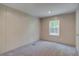 Carpeted bedroom features neutral walls and a window providing natural light at 413 Peacock Ln, Summerville, SC 29486