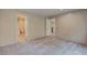 Spacious bedroom with neutral carpet, featuring two doorways to a bathroom and another room at 413 Peacock Ln, Summerville, SC 29486